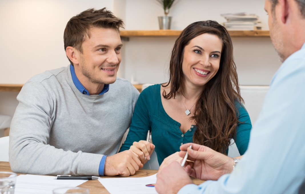 Young couple meeting financial advisor for investment